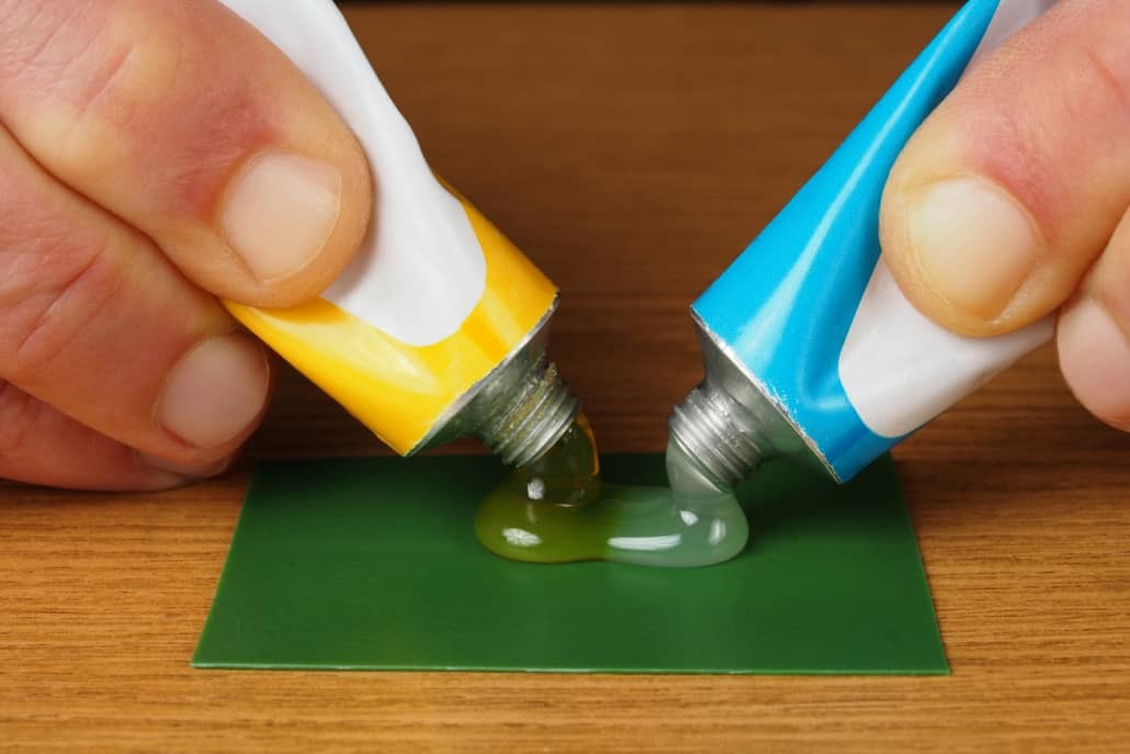 Mixing two component epoxy adhesives on green surface