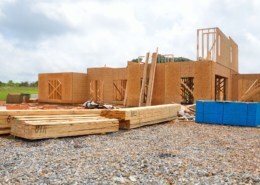 a wooden house being built using low carbon adhesives for construction