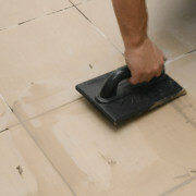 applying grout for natural stone with a trowel
