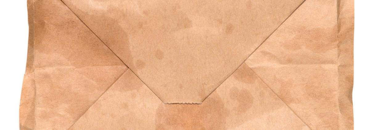 used paper bag with bio-based packaging adhesive
